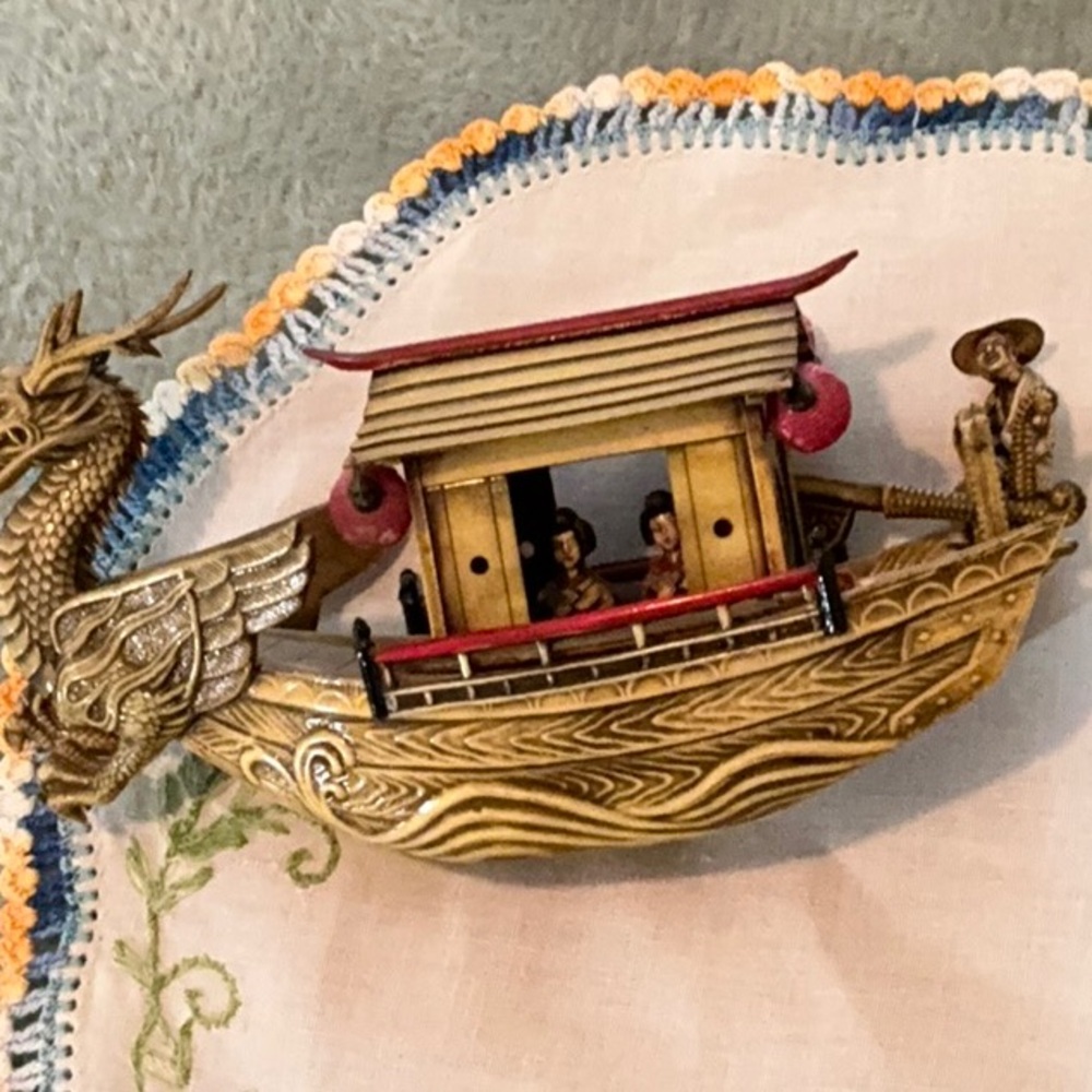 Vintage celluloid Japanese dragon ship, ornate Asian decor.